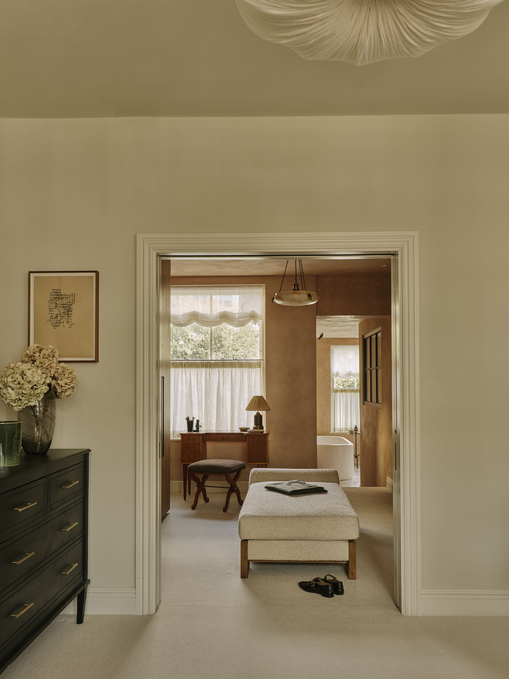 Looking into the dressing room from the bedroom, interior design by Studio Squire