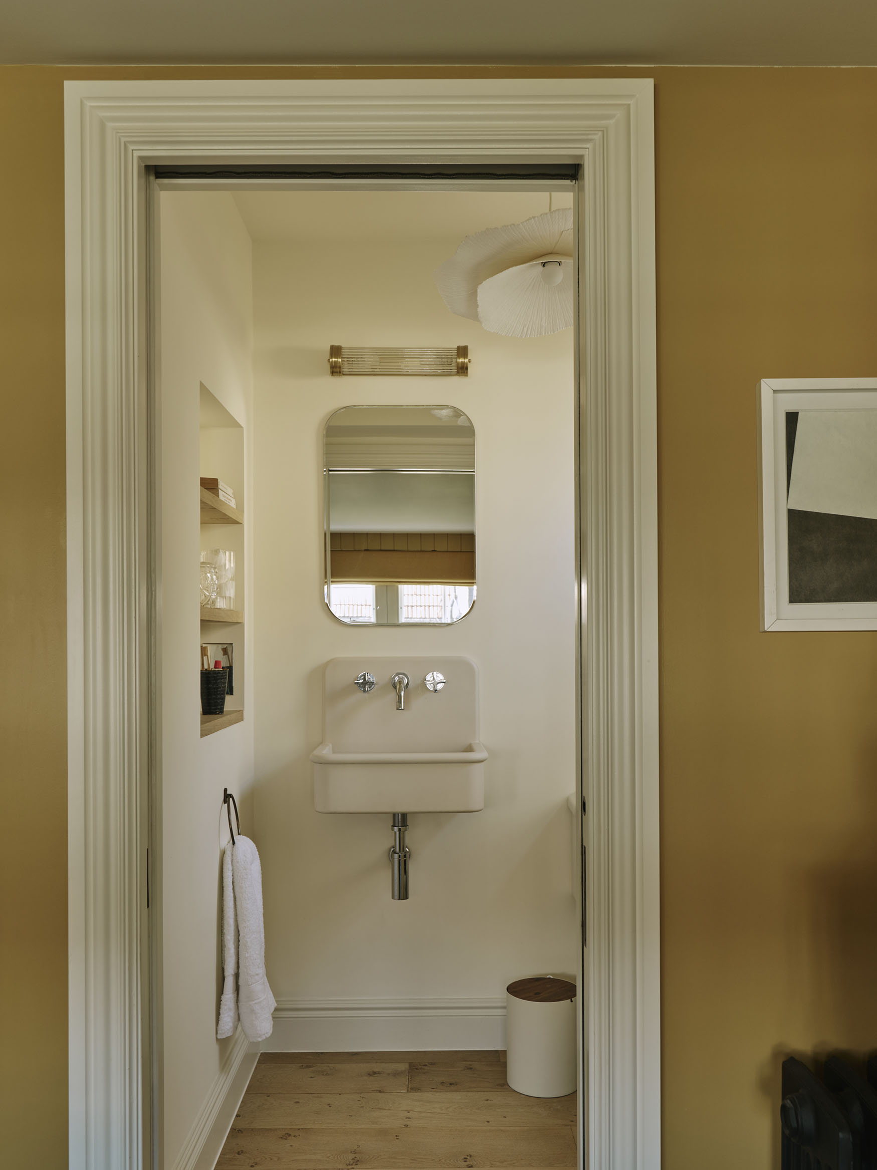 Looking into a bathroom, interior design by Studio Squire