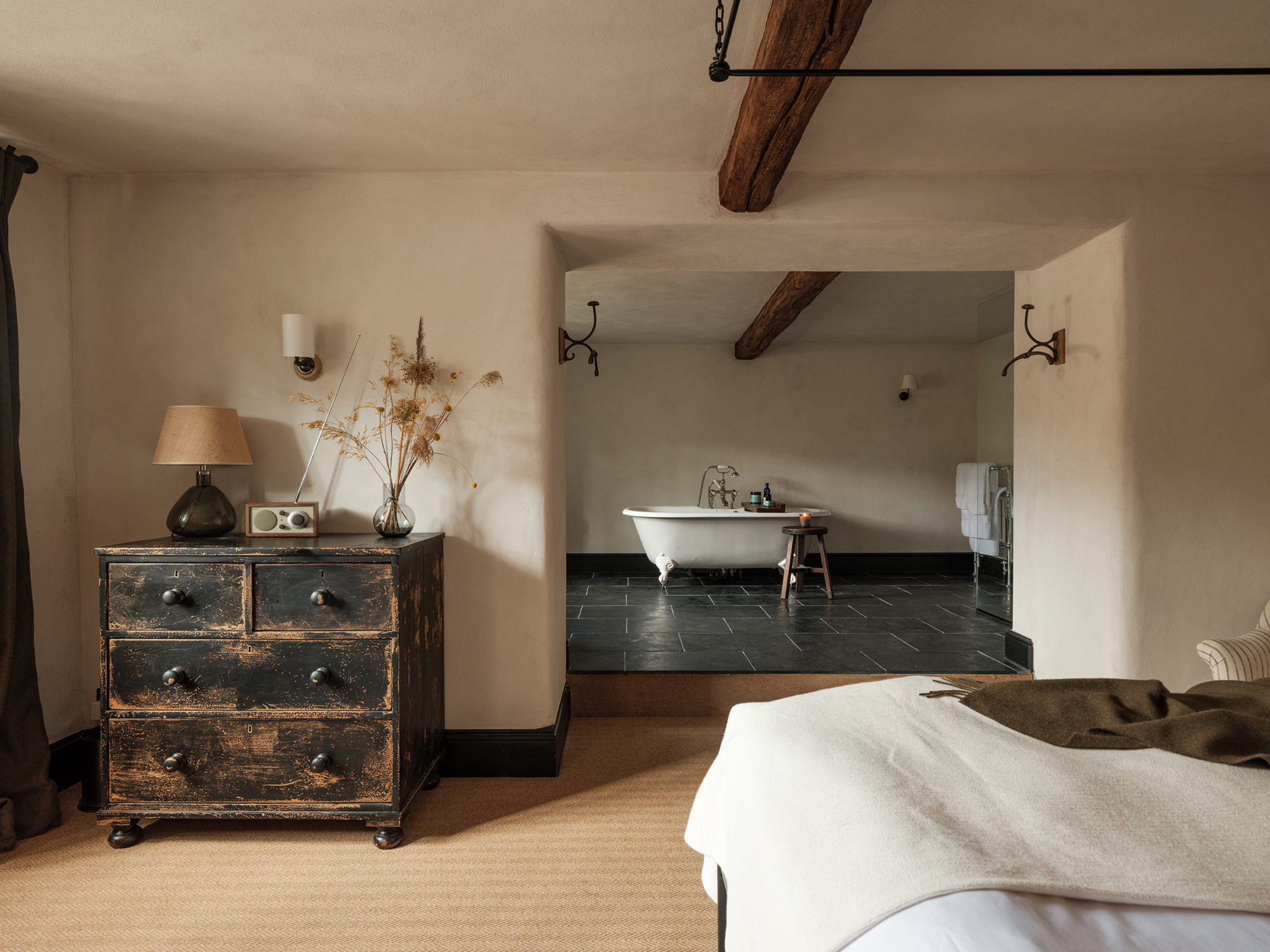 The Bull Charlbury hotel bedroom and bathroom with beautiful natural interior design